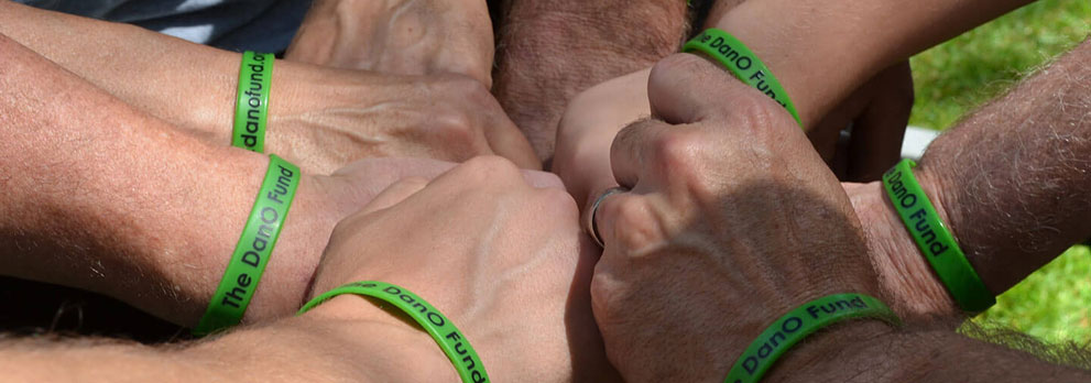 Hands Together Wearing DanO Fund Bracelets